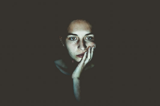 fatigued woman in front of screen